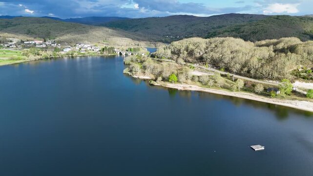 Aerial view of prada reservoir with bridge and forest