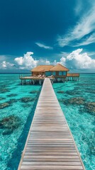 Fototapeta premium A wooden jetty leads to a bungalow set against turquoise waters beneath a cloudy sky — an idyllic backdrop for a luxurious getaway, meditation or daydreaming of a tropical paradise.