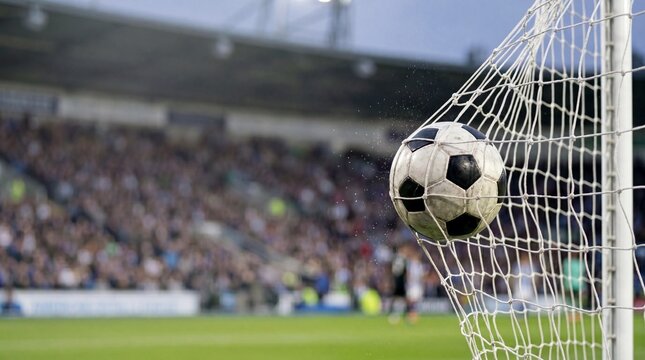 A soccer ball in a net, celebrating the perfect goal