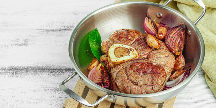 Ossobuco beef meat with spices and fresh herbs. Veal shank steak, traditional Italian ingredient
