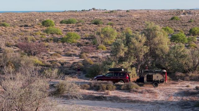 Discover dispersed camping in Baja California with an SUV and teardrop camper near the Sea of Cortez and ocean views.