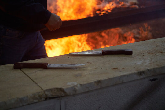 Burning fire pit used for roasting lamb during Samaritan Passover ritual