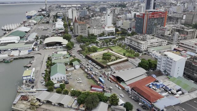 Drone orbits left in ultra wide shot of Maputo Fort on an overcast day in Maputo, Mozambique
