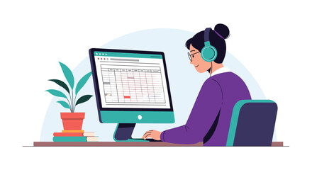 Fototapeta premium Focused woman wearing headphones and glasses sitting at a desk and working on a desktop computer with a plant nearby.