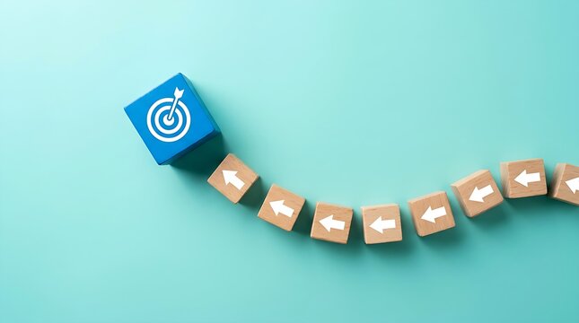 Conceptual image of a winding trail of arrow blocks focused on achieving a specific blue target on teal.