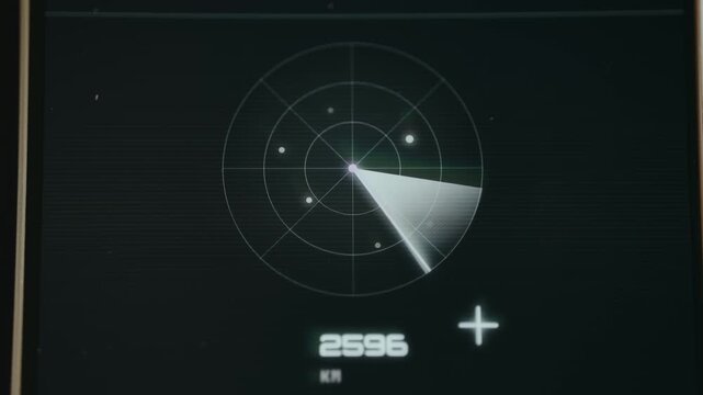 Circular radar scope with a sweeping scanner bar, objects plotted on the grid and distance measurement