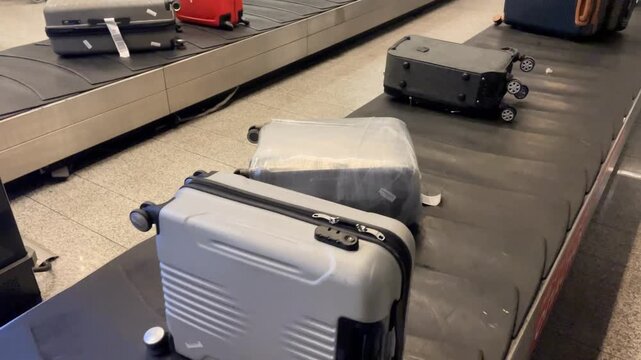 Luggage on airport conveyor belt background with suitcase and bags in baggage claim area