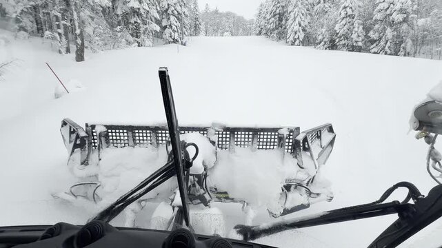 Snow Groomer Prepares Pristine Ski Slope at Winter Resort, Ensuring Perfect Conditions for Skiers and Snowboarders