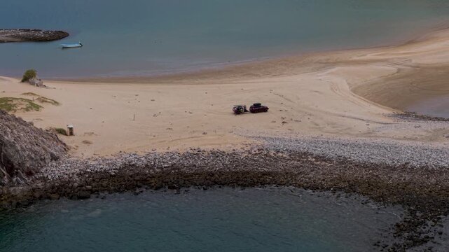 Camping at Punta Final in Gonzaga Bay with an SUV and a teardrop camper trailer on the beach in Baja California, Mexico