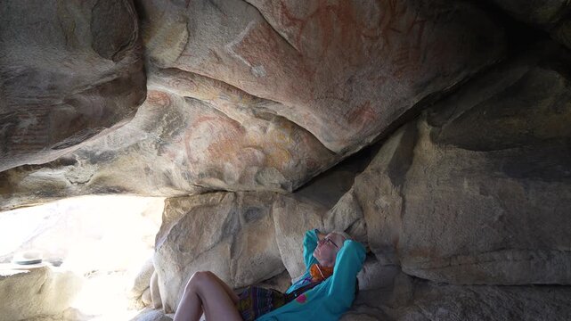 Explore prehistoric cave paintings in the desert of Catavina Baja California Mexico with a mature woman on an exciting hike.