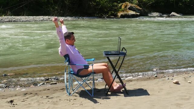 Remote Work Win - Happy Man in a Shirt and Underwear Raising Hands Celebrating. 