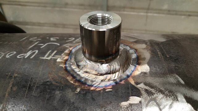 TIG Welding Process: Inconel 625 Filling Layers with Colorful Heat Tint on Steel Pipe, Industrial Cladding