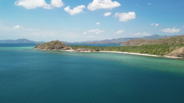 Aerial drone view Gili Sudak Indonesia sunny day featuring white sand beach turquoise lagoon tropical paradise island landscape