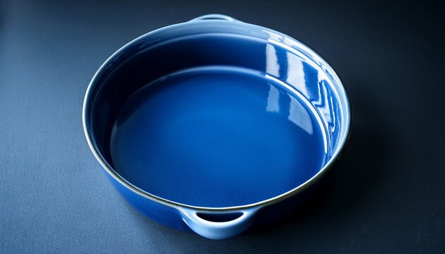 empty indigo colored baking dish isolated dark background copyspace beautiful blue ceramic baking dish