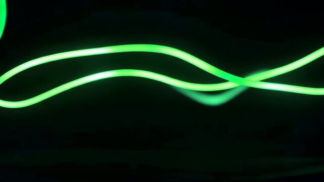 Abstract Green Light Trails on Black Background