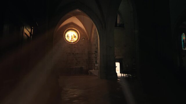 Issigeac Church Interior with Dramatic Sunlight Beams