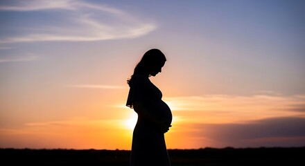 Fototapeta premium Pregnant woman standing in profile against vibrant sunset sky with wispy clouds and serene landscape