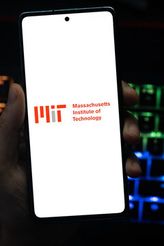 Punta Arenas, Chile &ndash; May 04, 2026: A person's hand holds a mobile smartphone displaying the red and gray Massachusetts Institute of Technology (MIT) logo and wordmark on a white screen