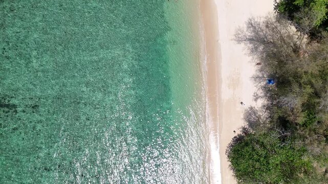 Aerial View of Serene Beach with Turquoise Water and Lush Greenery Capturing Tranquil Beauty of Nature and Inviting Atmosphere