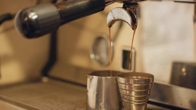 Coffee shop activity. Espresso being freshly prepared. Vibrant cafe scene with freshly brewed espresso flowing. Energetic coffee shop ambiance featuring steaming espresso and busy patrons