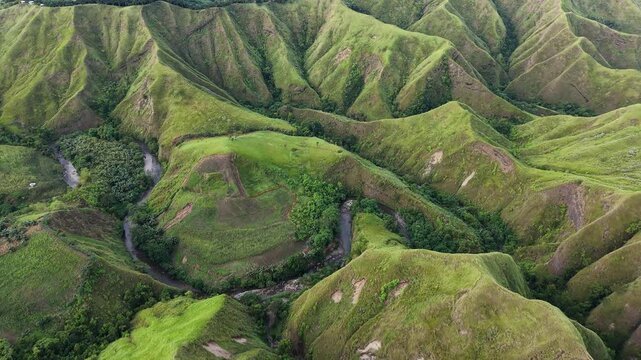 "Stunning 4K aerial footage of the Grand La Palmera Mountain Ridge in Sultan Kudarat, Mindanao. This rare, unspoiled mountain range features lush green peaks and deep tropical valleys. Shot with DJI M