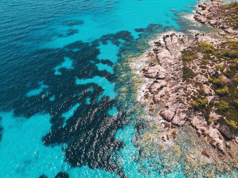 Aerial View of Turquoise Sea Water and Scenic Rocky Coastline, Kavourotrypes and Orange beach in Sithonia, Chalkidiki, Greece