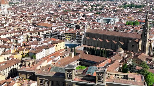 Aerial drone view of Florence city center around historic Lungarni riverside walkways and Arno River bridges