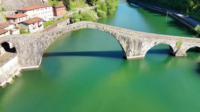 Aerial view of Devil's Bridge Ponte della Maddalena Borgo a Mozzano over Serchio River Tuscany Italy