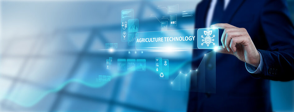 Businessman hand holding agriculture technology interface on digital screen, smart farming solutions, precision agriculture, digital crop monitoring and modern agritech innovation