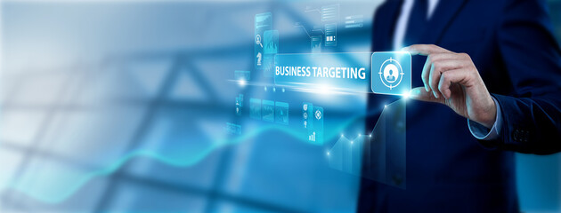 Fototapeta premium Marketing specialist hand holding business targeting interface on digital screen, customer segmentation strategy, audience analysis, market targeting and sales optimization concept