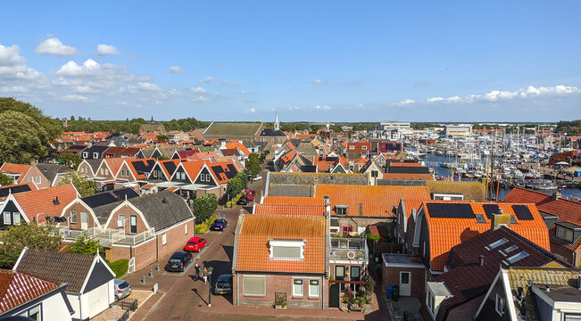 Colorful rooftops with harbor in background, Urk