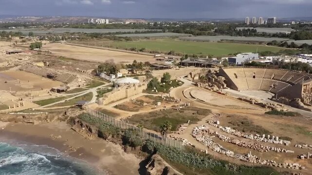 Caesarea, Israel - Ancient Roman Theater and Archaeological Park by the Mediterranean Sea coast, Aerial shot with Drone
