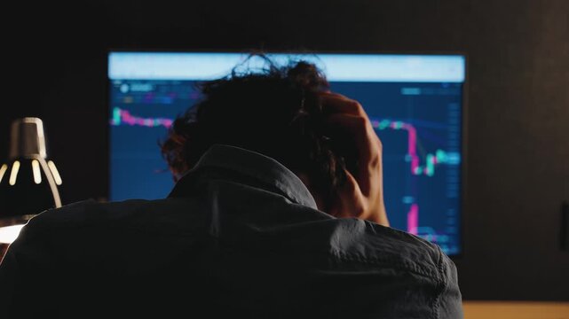 Cryptocurrency and stock online trading digital finance. Investor analyzes financial market charts data graphs. Global market analysis brokerage services. man watches exchange rate collapse in stress