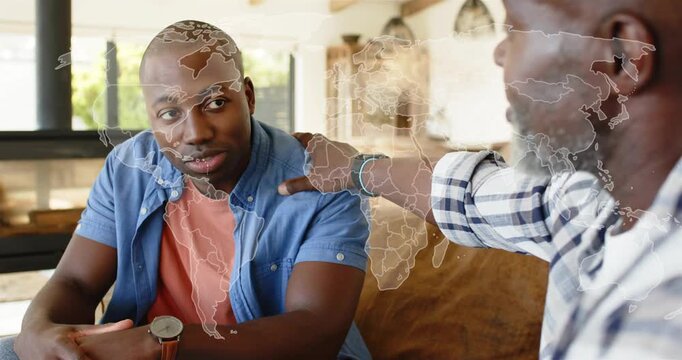 Elder man placing hand on shoulder and causing faint map overlaying faces guiding family therapy
