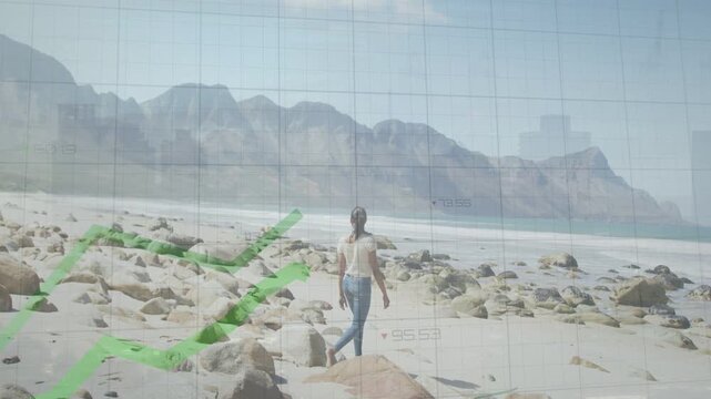 Woman walking rocky shore using stick, grid emerging and green line showing tech data watching sea