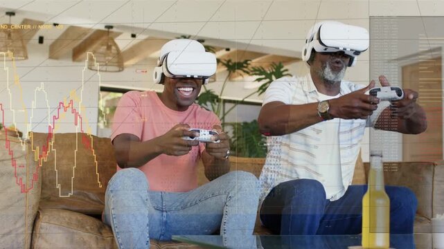 Father and son tapping VR controllers, leaning in on sofa, revealing HUD charts for shared gaming