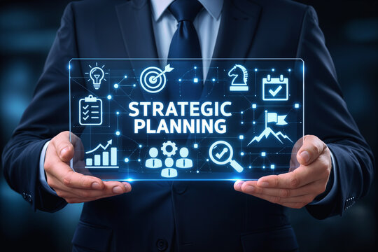 Businessman holding transparent screen with strategic planning icons target strategy workflow analysis team leadership goals vision management concept for corporate planning presentation and roadmap