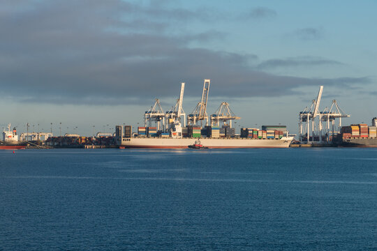 Canada, BC, Delta.  Freighter loading containers at Deltaport.