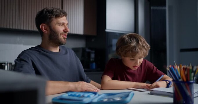 Joyful Father Expresses Pride And Encouragement To His Son Through Energetic Hand Signs And Praise