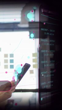 Vertical video: Woman shifting phone up, rotating device in tech office making AR panel readable