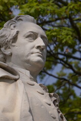 Fototapeta premium Vertical close up portrait of the statue of German writer Johann Wolfgang von Goethe on Goethe Memorial in Tiergarten Park, Berlin, Germany