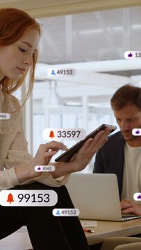 Vertical video: Woman tapping tablet causing floating alert badges growing counts for marketing