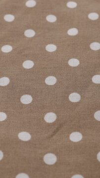 polka dots brown cotton or linnen natural fabric textile background vertical video 