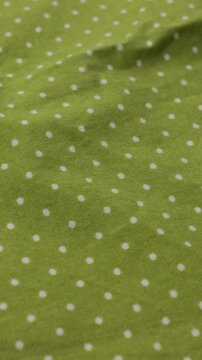 polka dots green cotton or linnen natural fabric textile background vertical video 