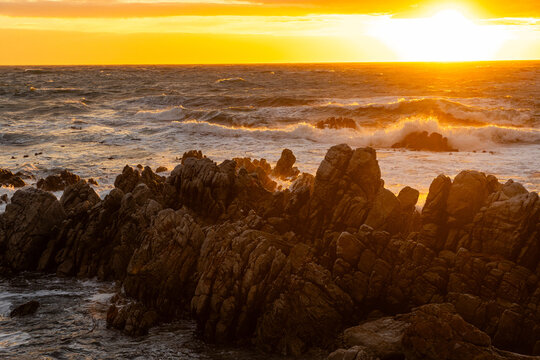 stormy waves crashing over rocky coastline, DeKelders, South Africa
