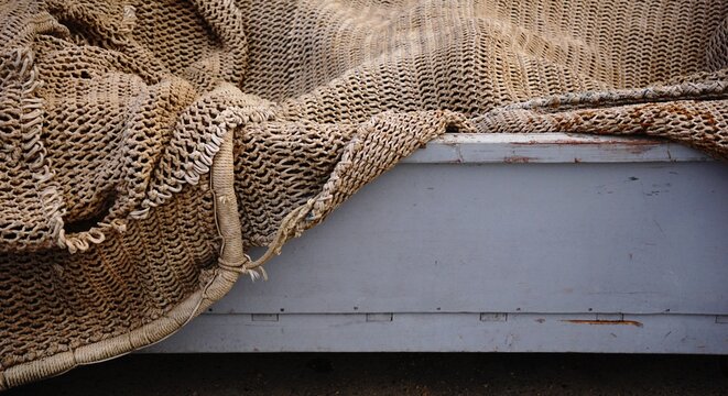 traditional fishing net in wooden box on the pier