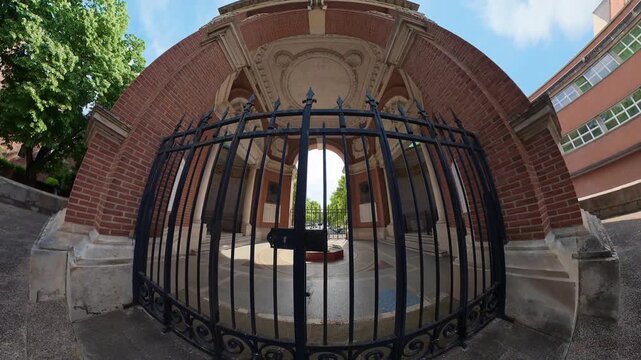 360 inside view of brick arch pavilion iron gate circular fountain courtyard Albi France