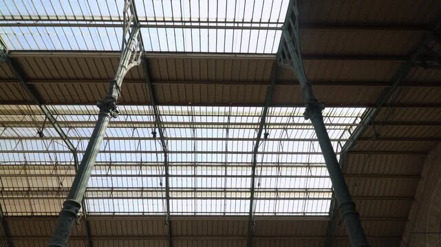 Industrial architecture detail of the historic Paris Nord railway ceiling in Paris, France.