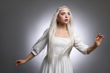 Obraz premium Beautiful elf girl on grey gradient background