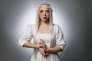 Obraz premium Beautiful elf girl on grey gradient background